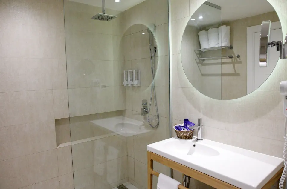 Standard Room bathroom with glass shower at Grand Sirenis Punta Cana Resort & Aquagames.