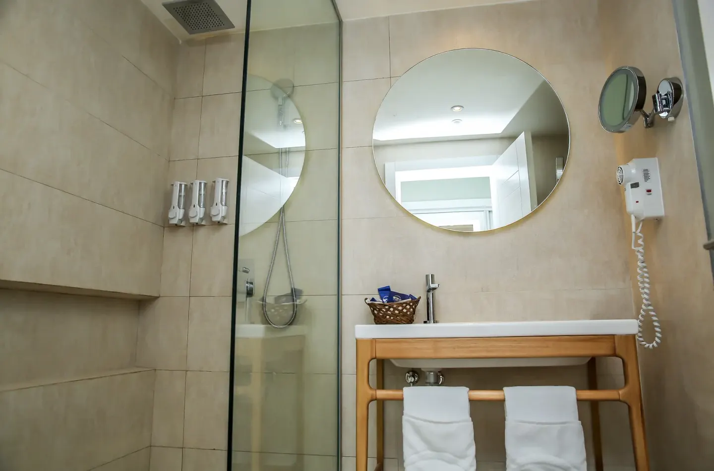 Standard Room bathroom vanity and shower at Grand Sirenis Punta Cana Resort & Aquagames.