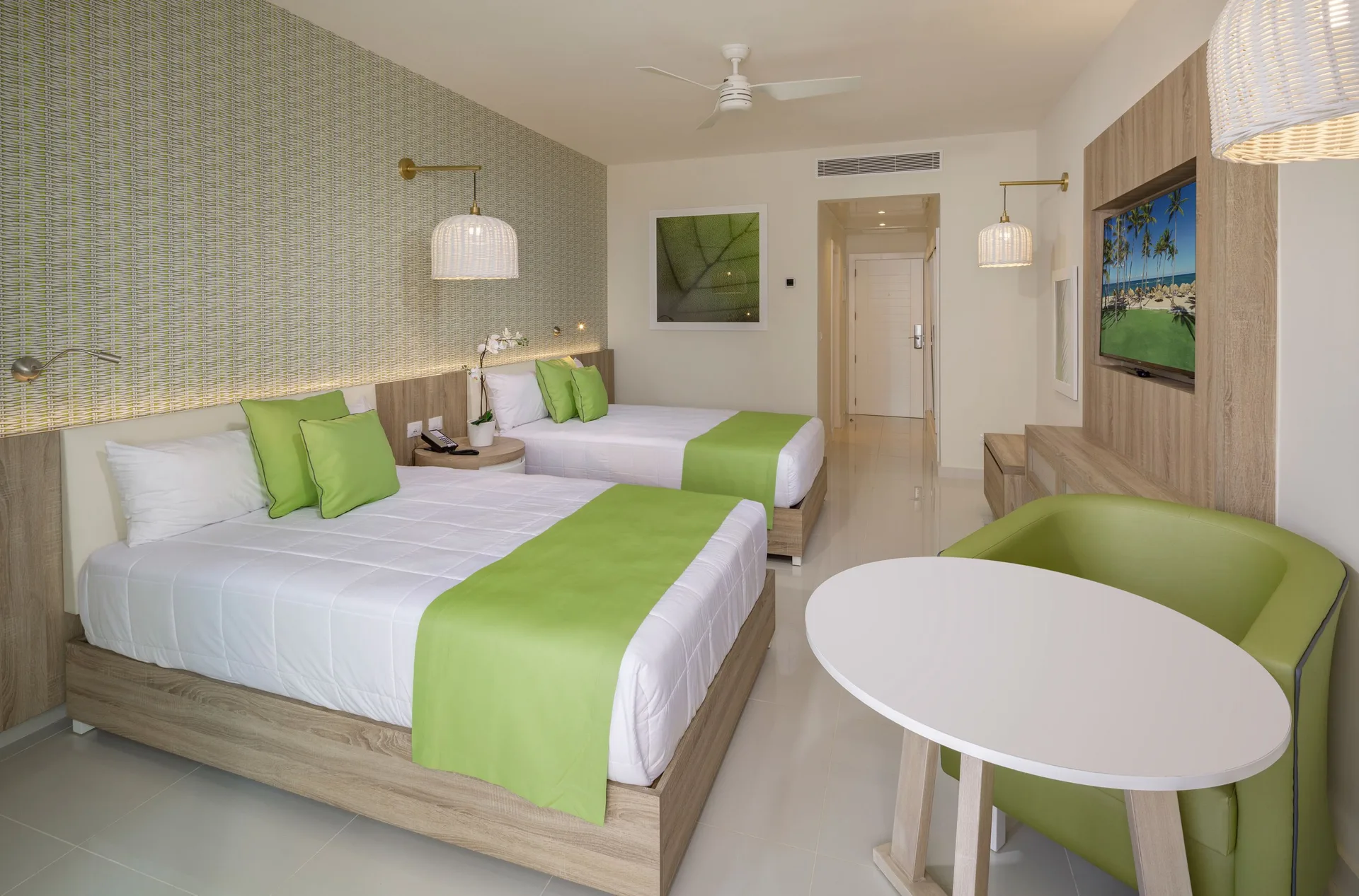 Standard Room with two beds and seating at Grand Sirenis Punta Cana Resort & Aquagames.