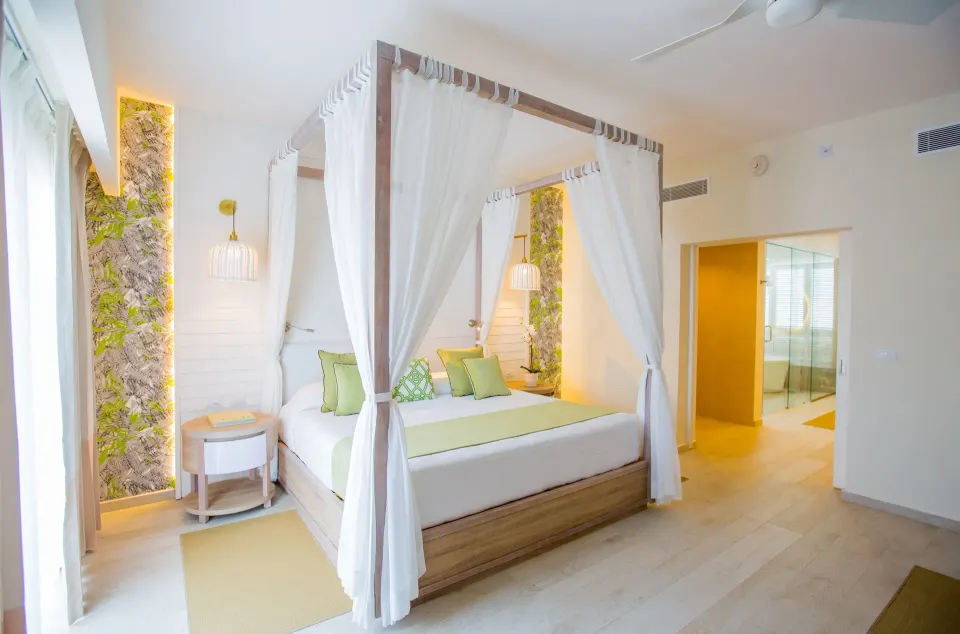 Canopy bed in a renovated suite at Grand Sirenis Punta Cana Resort & Aquagames.