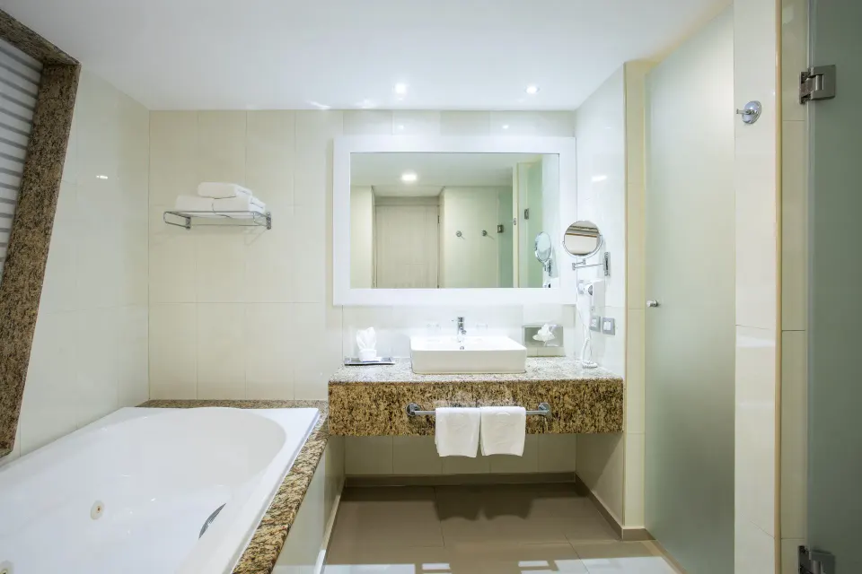 Bathroom vanity and jetted tub corner in a suite at Grand Sirenis Riviera Maya Resort & Spa