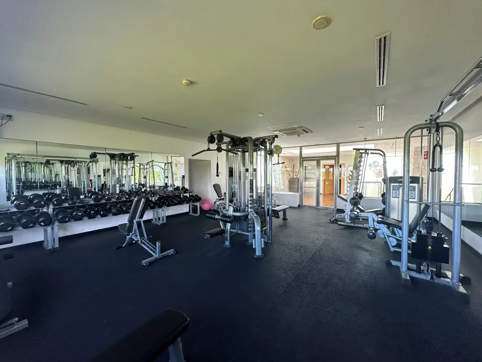 Resort fitness room with weight rack and strength machines at Grand Sirenis Riviera Maya Resort & Spa