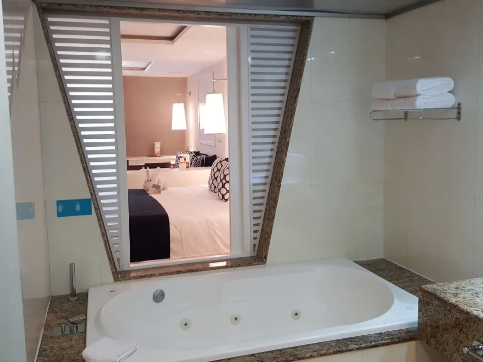 Jetted bathtub looking through to the bedroom in a suite at Grand Sirenis Riviera Maya Resort & Spa