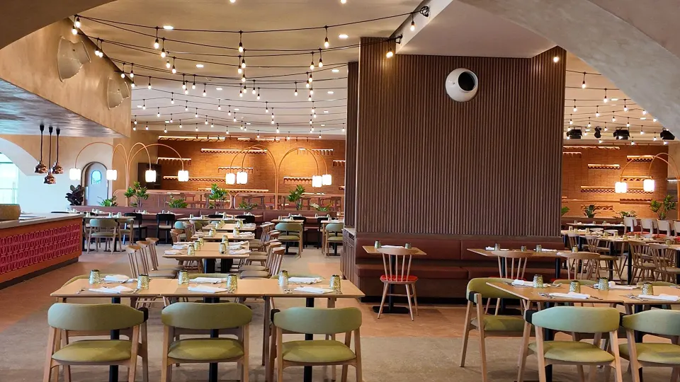 Bright buffet dining area with mixed seating and wood accents at Grand Sirenis Riviera Maya Resort & Spa