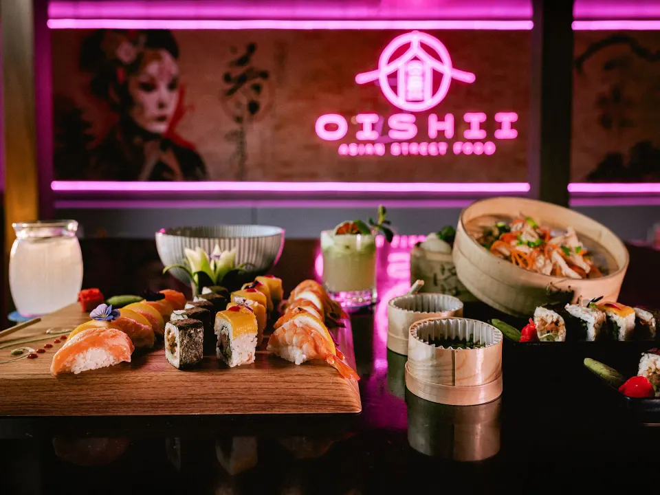 Sushi and bowls on a counter with OISHII sign at Grand Sirenis Riviera Maya Resort & Spa