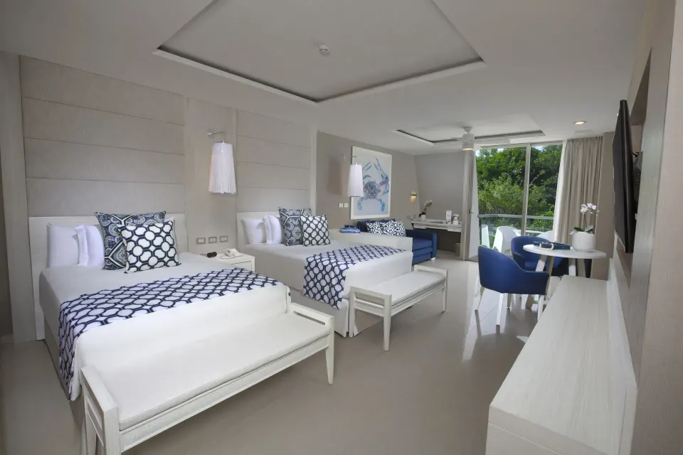 Junior suite with two double beds and balcony at Grand Sirenis Riviera Maya Resort & Spa
