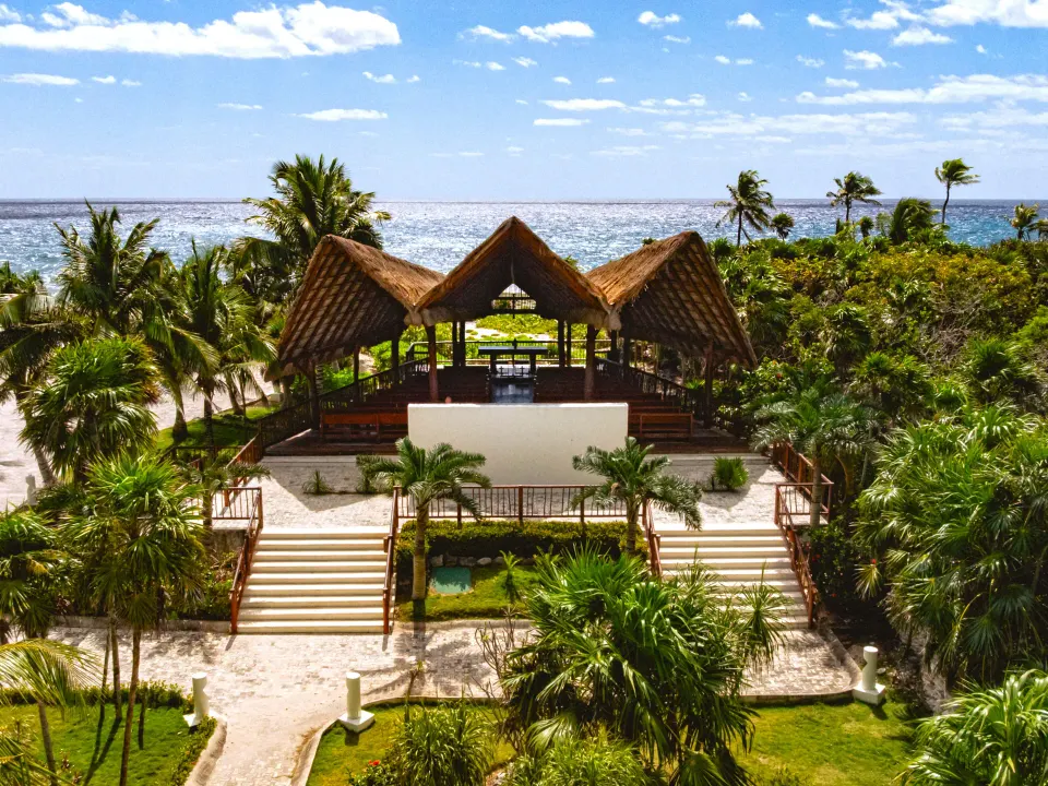 Thatched-palapa beachfront pavilion and steps at Grand Sirenis Riviera Maya Resort & Spa