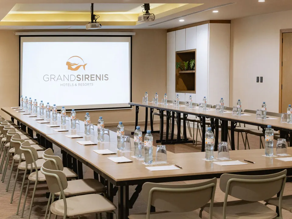 U-shaped conference room with branded projection screen at Grand Sirenis Riviera Maya Resort & Spa