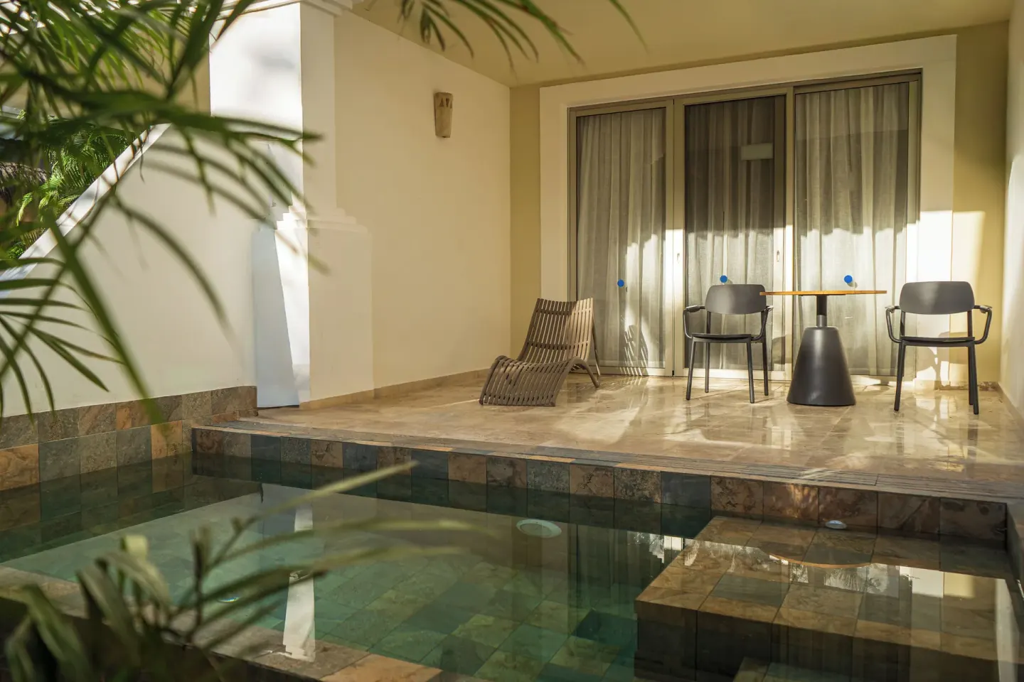 Private terrace with plunge pool and seating outside a guest room at Grand Sunset Princess.