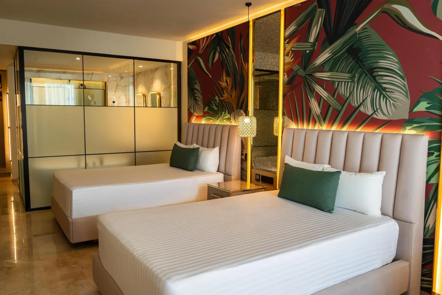 Two-bed guest room with glass bathroom partition at Grand Sunset Princess.