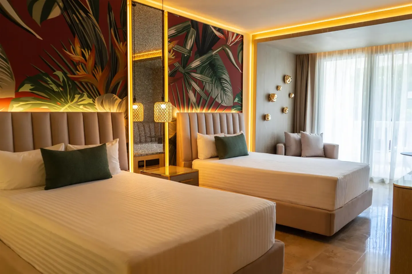 Guest room with two beds and tropical wall art at Grand Sunset Princess.