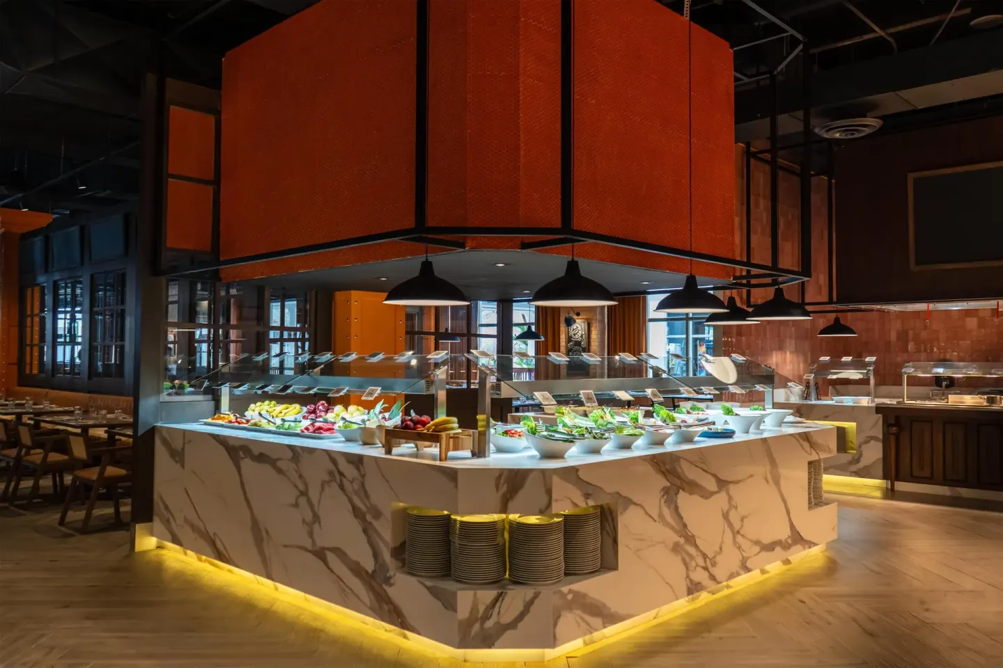 Illuminated buffet island with salads and fruit at Grand Sunset Princess.