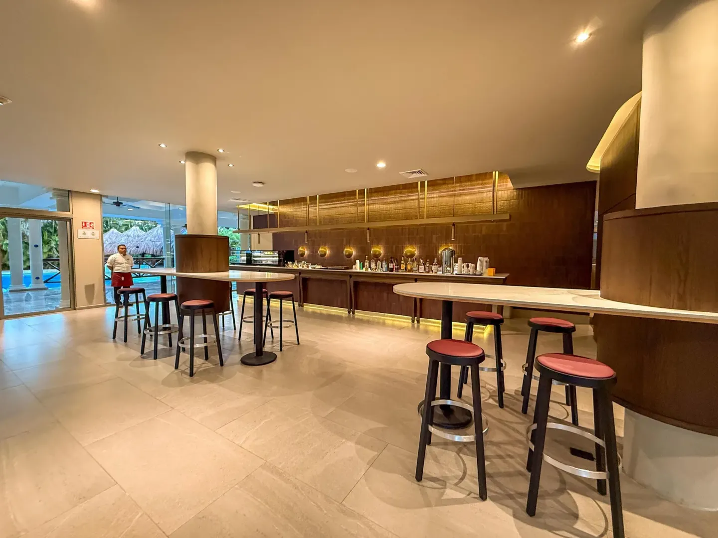 Lobby bar with high tables and pool views at Grand Sunset Princess.