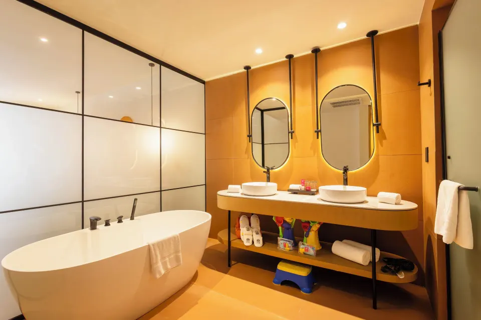 Family Club Room bathroom with soaking tub and twin sinks at Grand Sunset Princess.