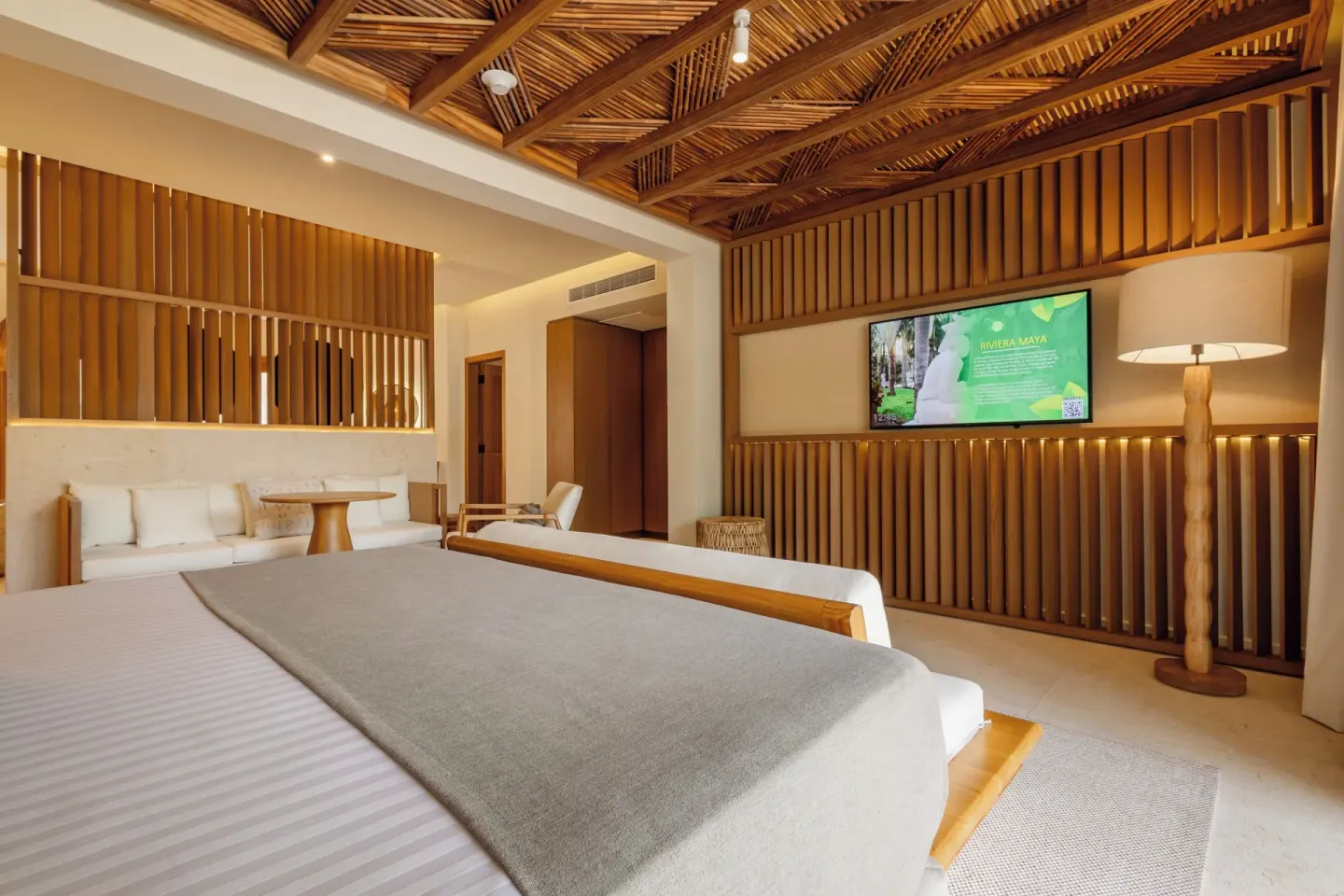 Laguna Villa Suite king bed facing the TV wall at Grand Sunset Princess.