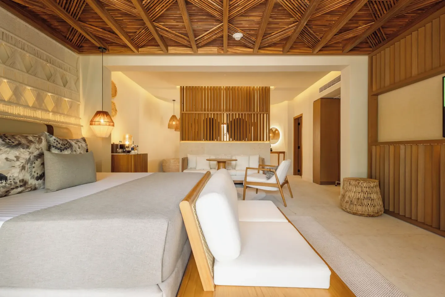 Laguna Villa Suite king bed, sofa, and TV wall at Grand Sunset Princess.