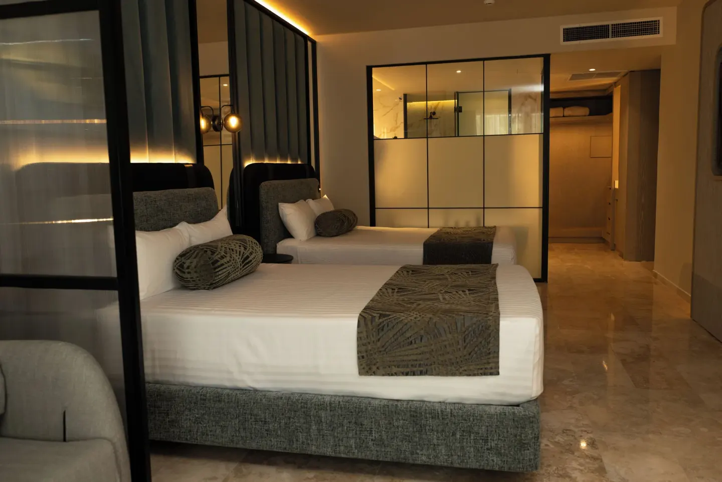 Platinum Suite double beds with bathroom partition and entry corridor at Grand Sunset Princess.