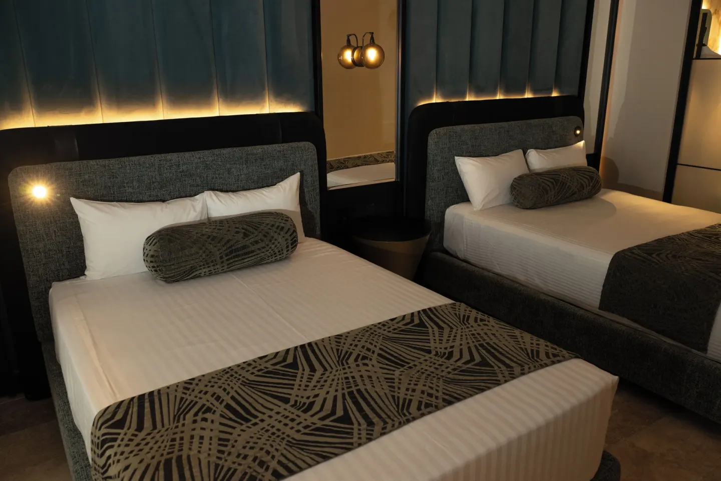Platinum Suite double beds with matching bolsters and lit headboards at Grand Sunset Princess.