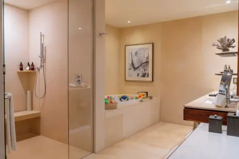 Family Duplex bathroom with shower, tub, and double vanity at Grand Velas Los Cabos.
