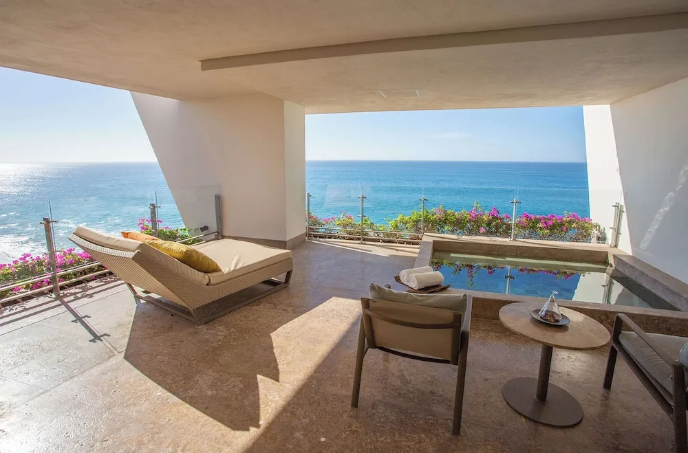 Grand Class Corner Suite terrace with plunge pool, loungers, and ocean view at Grand Velas Los Cabos.