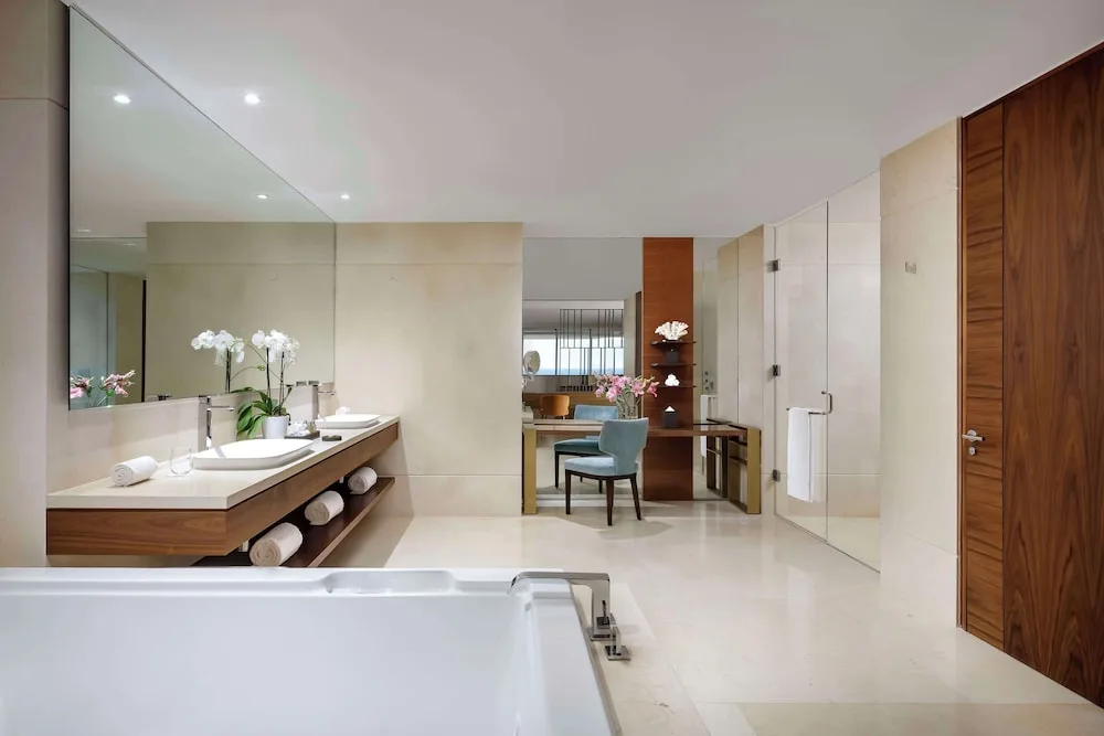 Grand Class Suite Ocean Front bathroom with tub and vanity at Grand Velas Los Cabos.