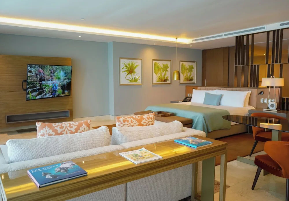 Grand Class Suite Ocean Front with king bed and lounge area at Grand Velas Los Cabos.