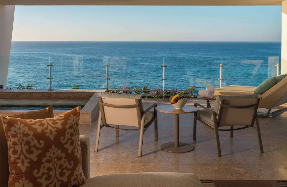 Grand Class Suite Ocean Front terrace with seating and ocean view at Grand Velas Los Cabos.