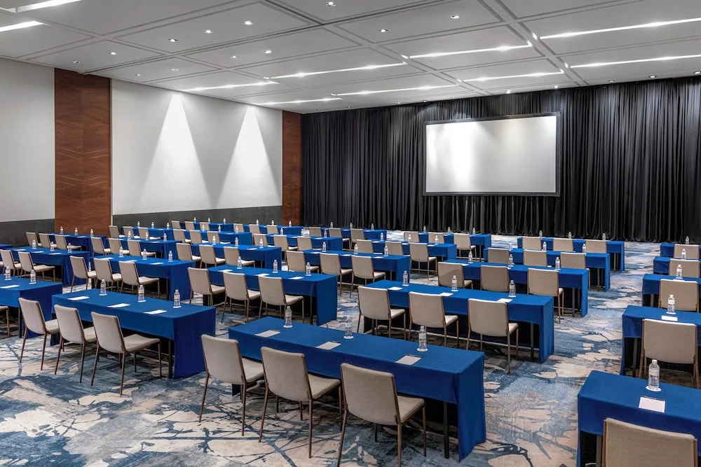 Conference room with blue classroom tables at Grand Velas Los Cabos.