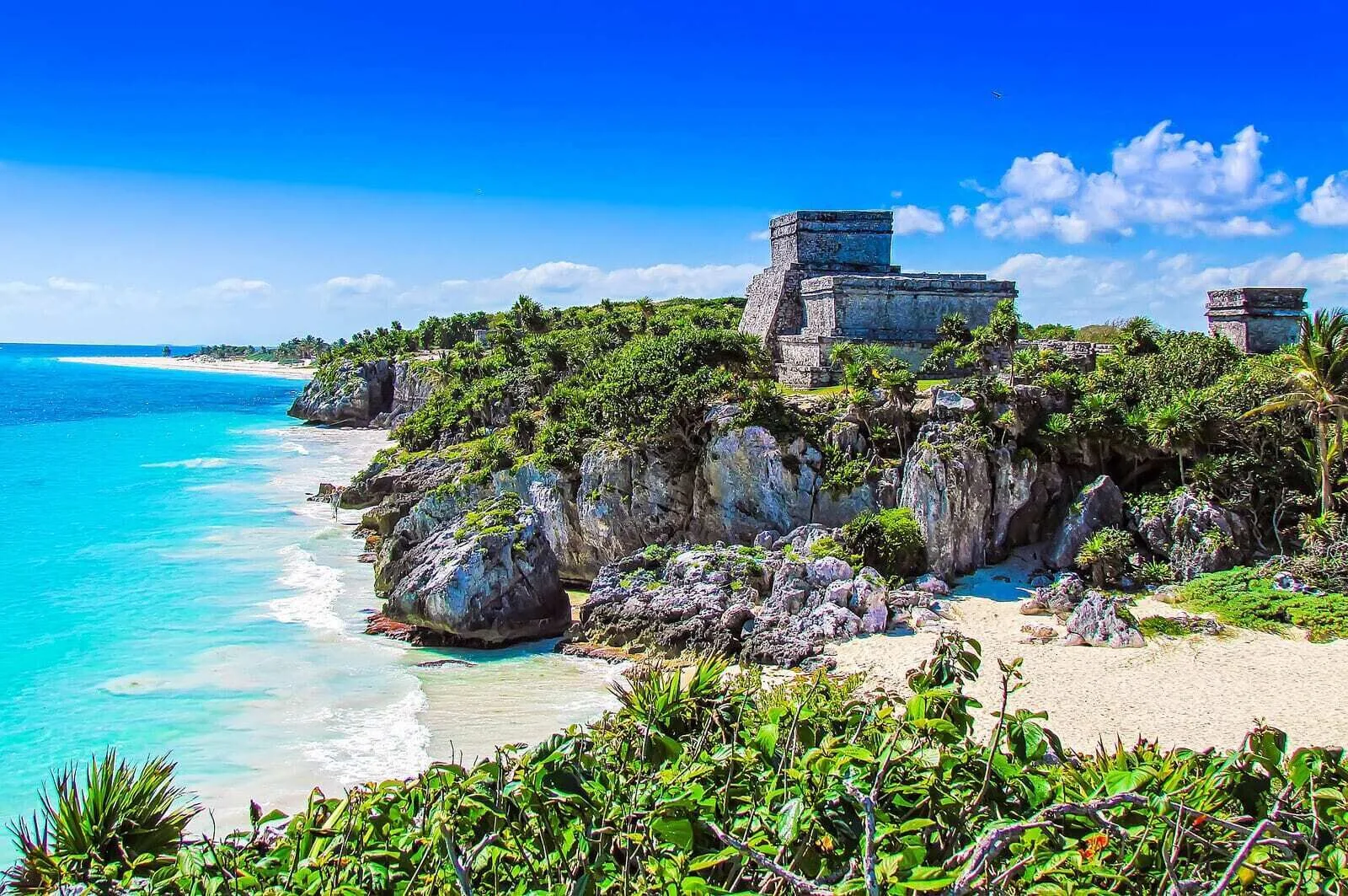 Clifftop ruins overlooking a turquoise beach near Grand Velas Riviera Maya.