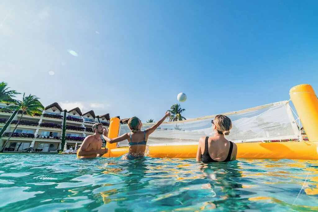 Guests play volleyball in the pool at Grand Velas Riviera Maya.
