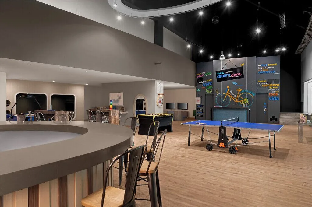 Teen lounge with ping-pong, foosball and counter seating at Grand Velas Riviera Maya.