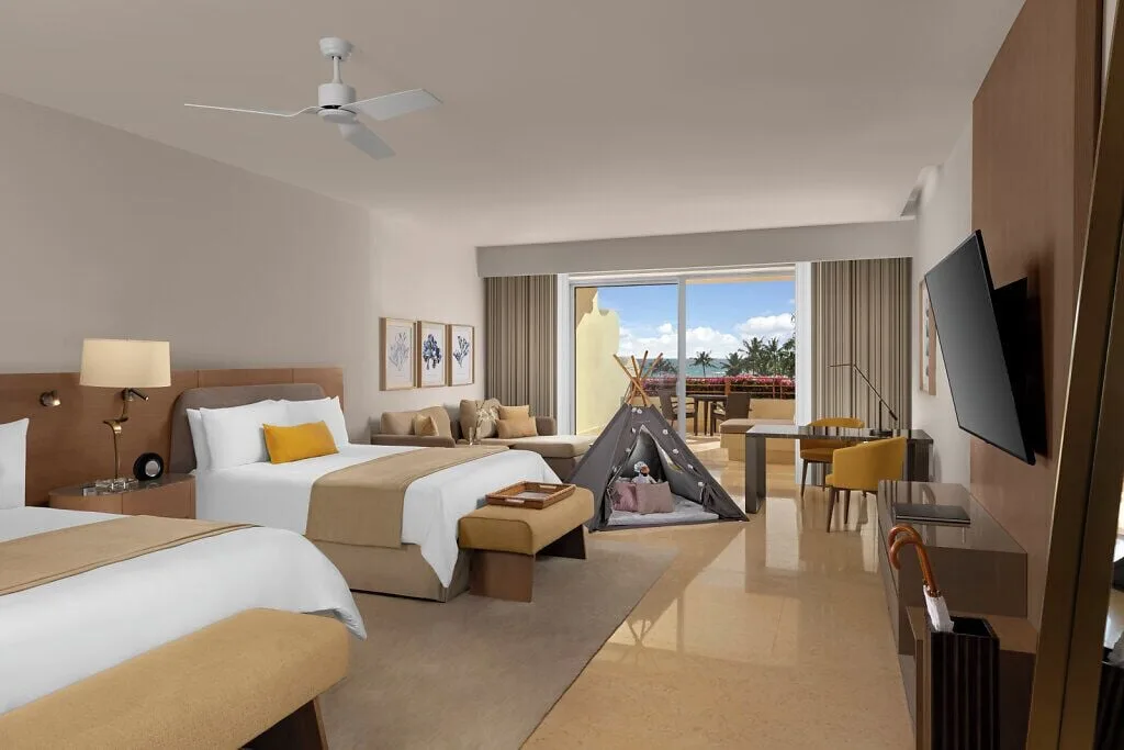 Ambassador Suite Ocean View with two beds and balcony at Grand Velas Riviera Maya.
