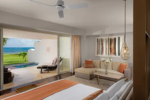 Grand Class Pool Suite with king bed, sofa and private plunge pool terrace at Grand Velas Riviera Maya.
