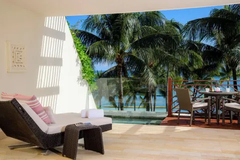 Grand Class Pool Suite Ocean Front terrace with lounge chair and plunge pool at Grand Velas Riviera Maya.