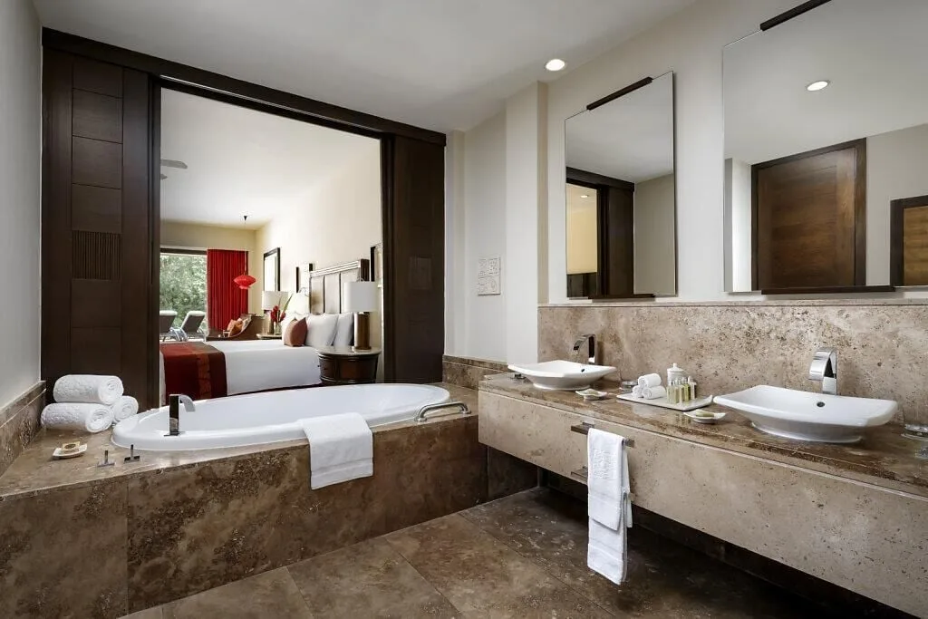 Nature View Suite bathroom with soaking tub and double sinks at Grand Velas Riviera Maya.