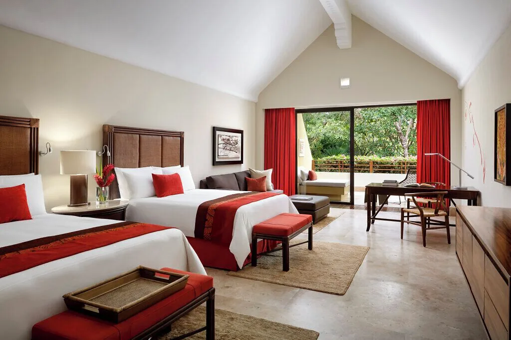 Nature View Suite with two beds and balcony greenery at Grand Velas Riviera Maya.