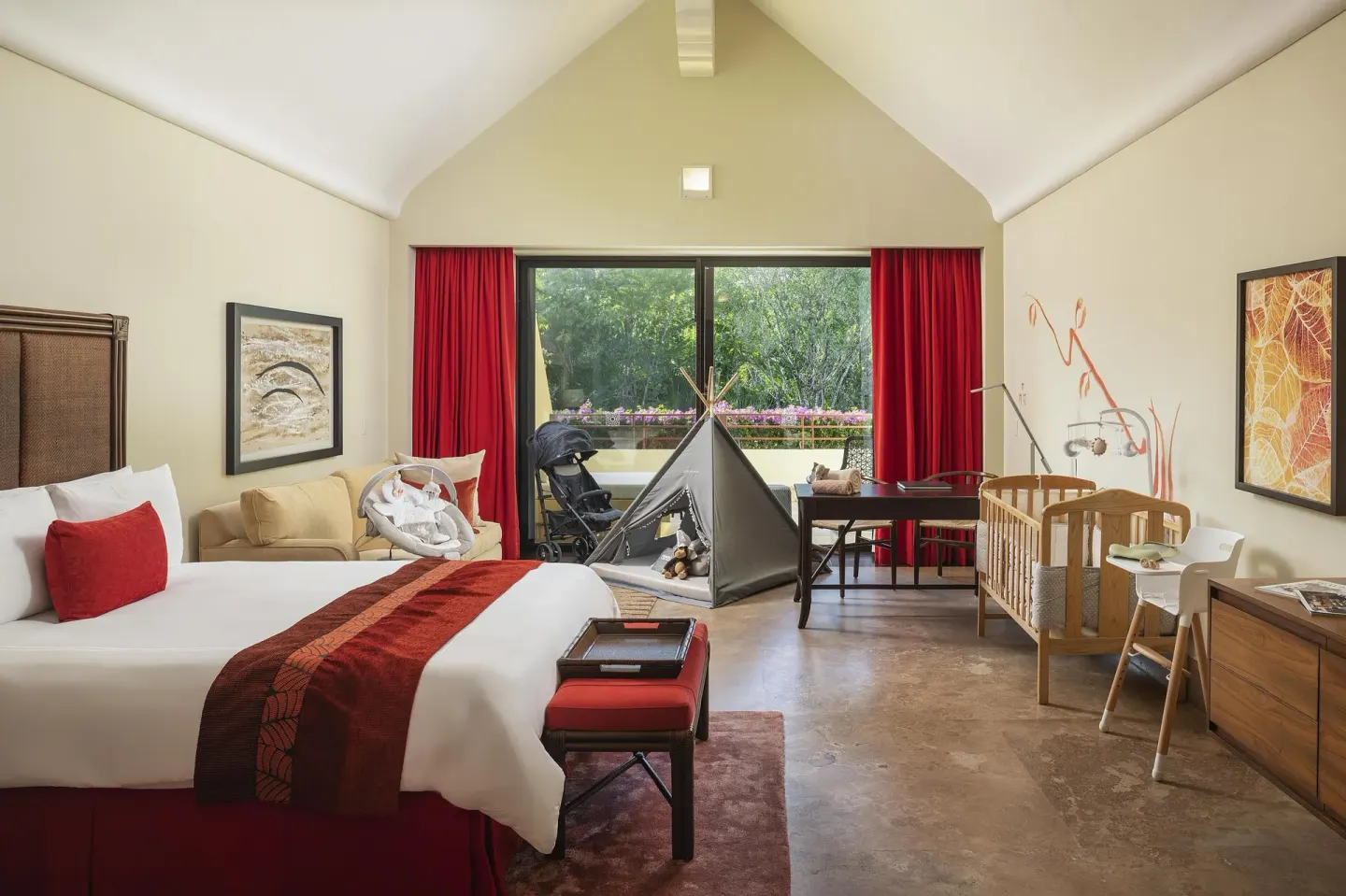 Zen Grand family suite bedroom with king bed and nursery items at Grand Velas Riviera Maya