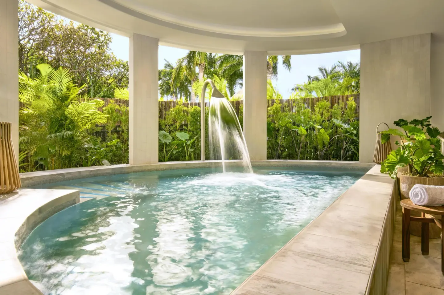 Covered spa pool with a waterfall feature at Grand Wailea Maui.