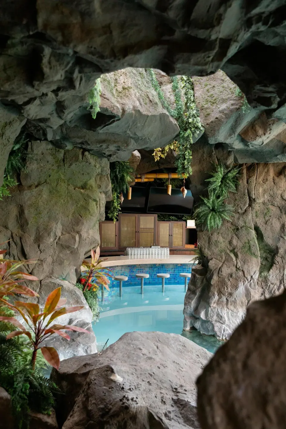 Cave-style swim-up bar with rock walls and pool stools at Grand Wailea Maui.