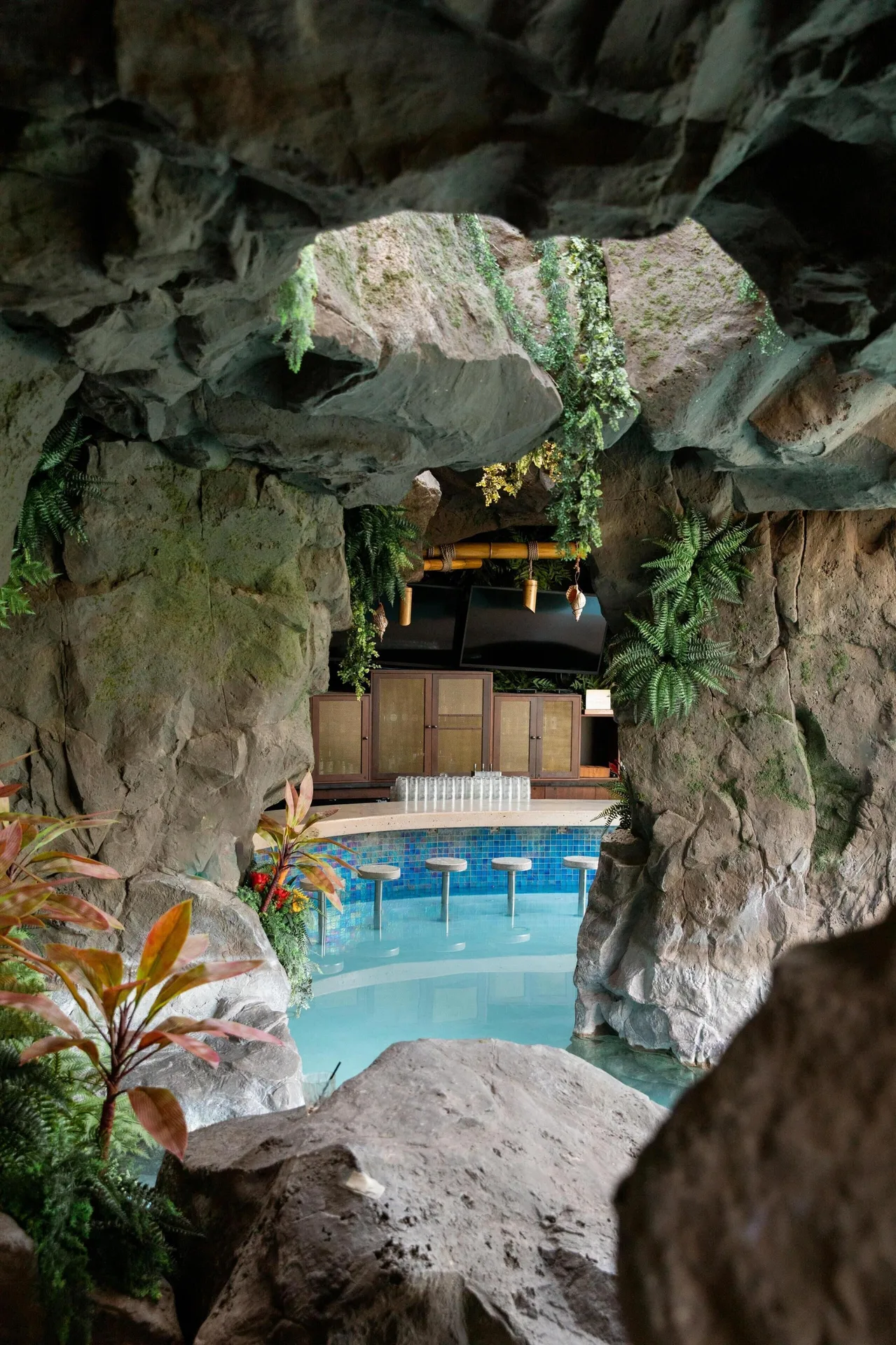Cave-style swim-up bar with rock walls and pool stools at Grand Wailea Maui.