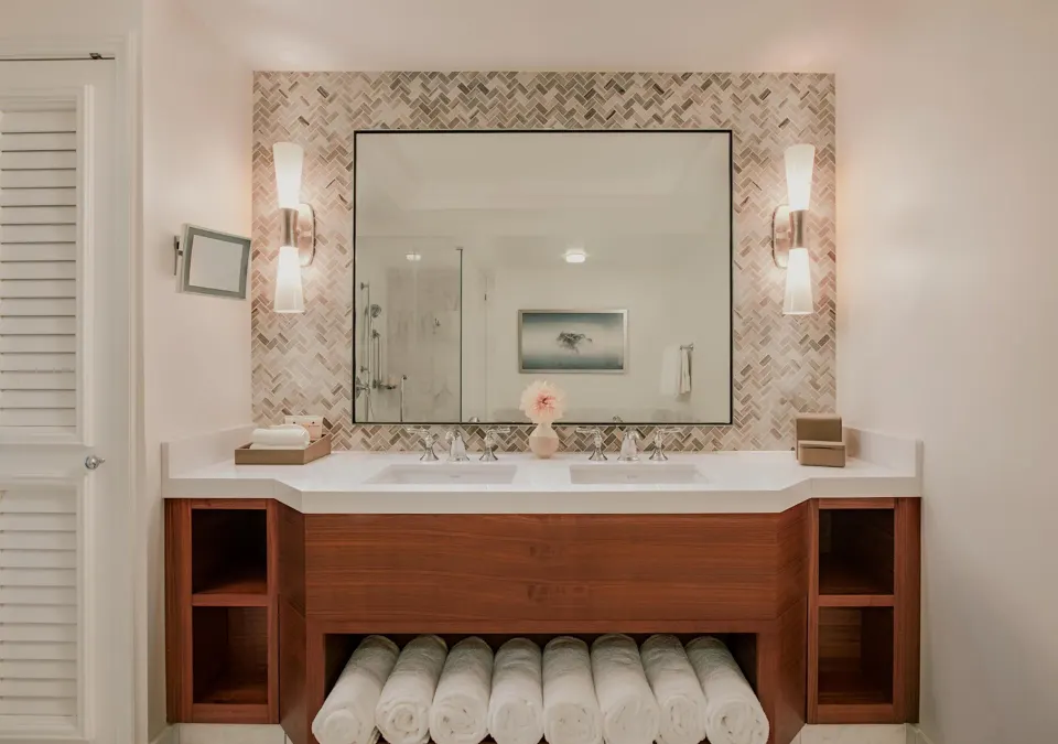 Club Suite bathroom vanity with two sinks and rolled towels at Grand Wailea Maui.