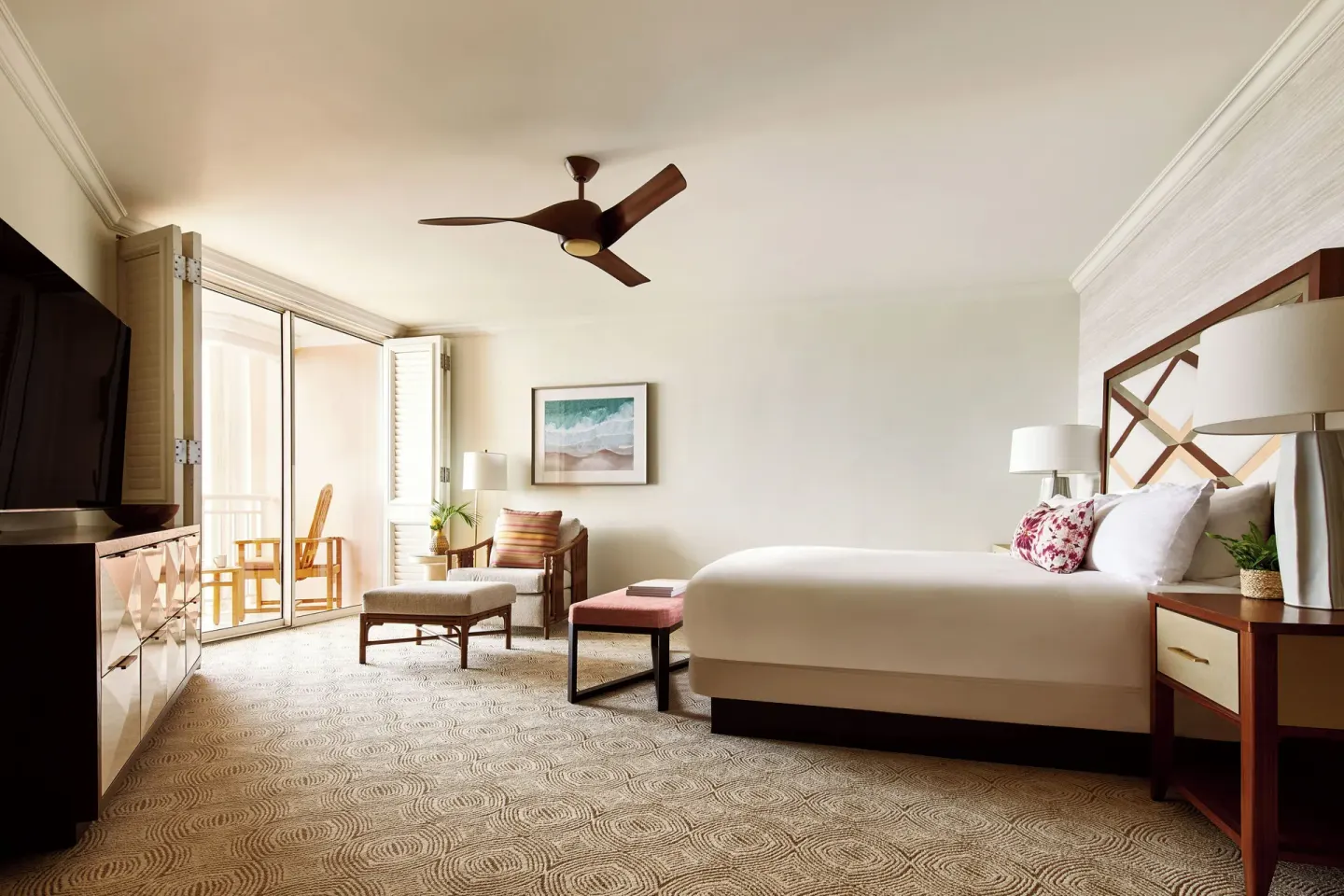 Club Suite bedroom with king bed and balcony doors at Grand Wailea Maui.