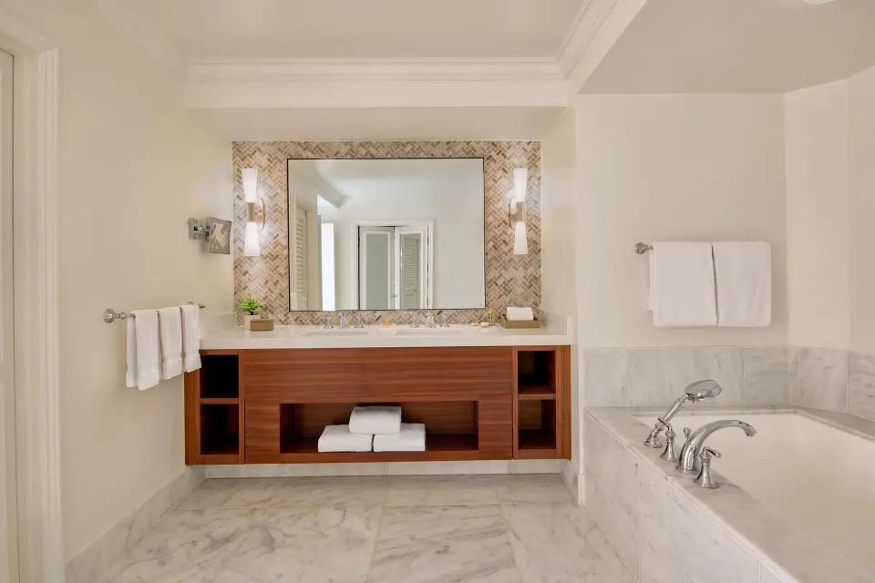 Bathroom in the Napua Nani ocean view suite at Grand Wailea Maui with vanity and soaking tub.