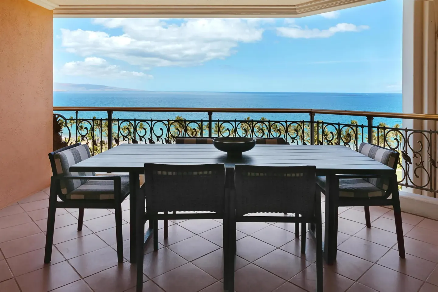 Napua Malu Suite lanai dining table overlooking the ocean at Grand Wailea Maui.