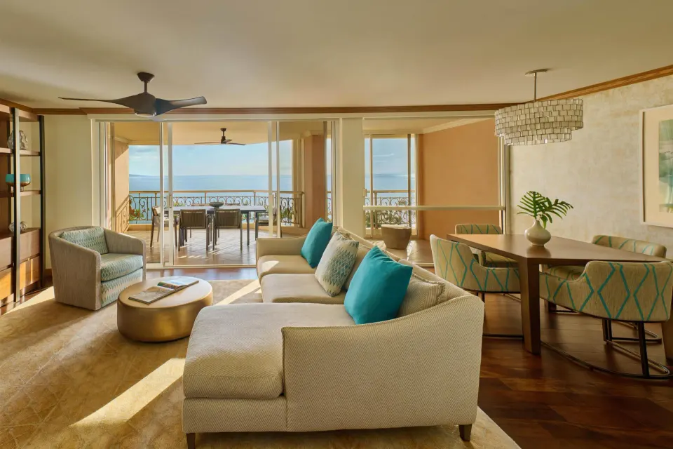 Napua Malu Suite living and dining area with ocean-view lanai at Grand Wailea Maui.