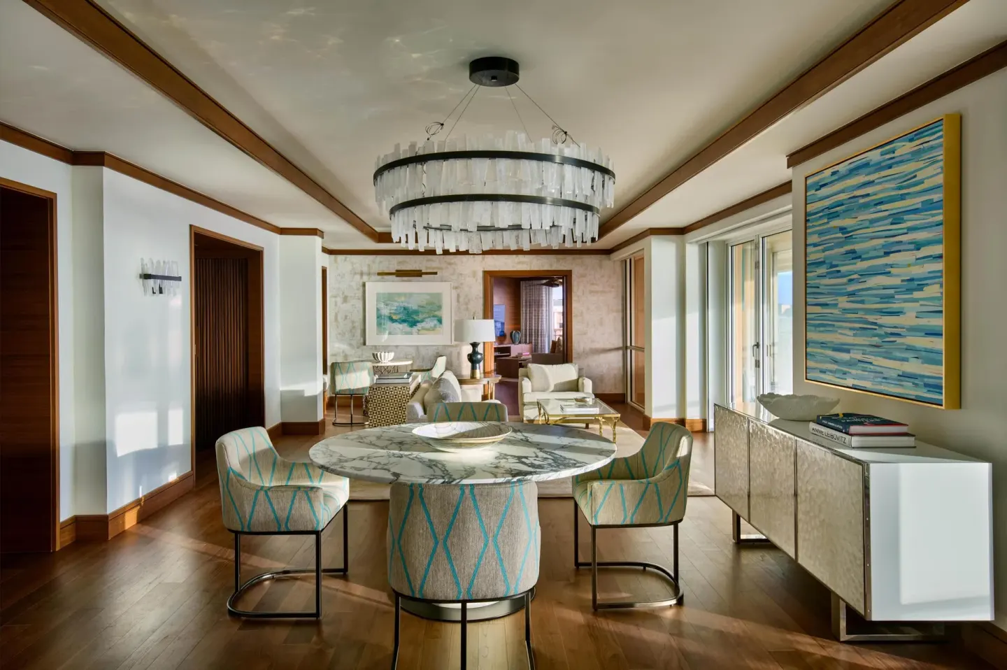 Grand Suite dining area with marble table and chandelier at Grand Wailea Maui.