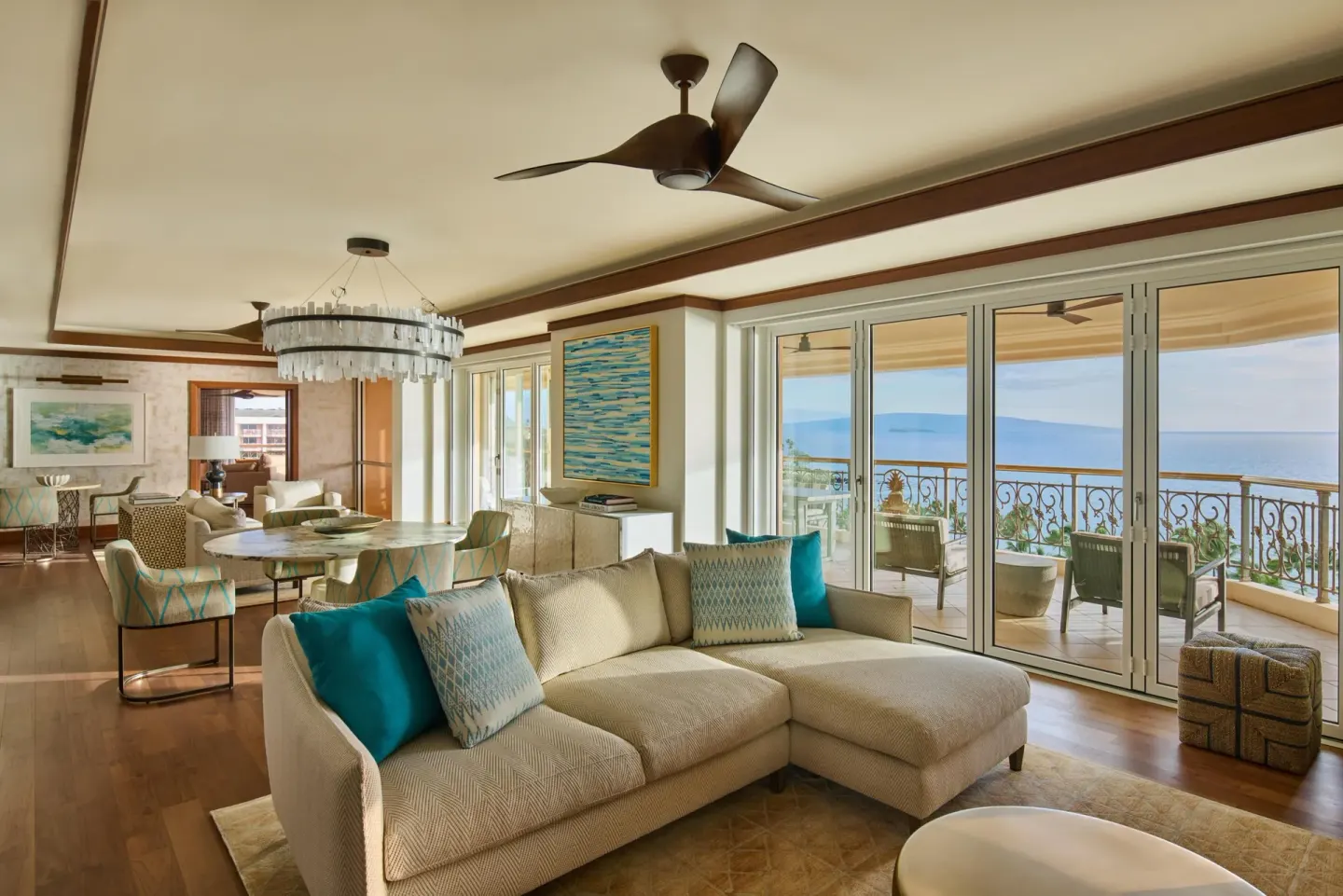 Spacious suite lounge with dining area and ocean balcony at Grand Wailea Maui.
