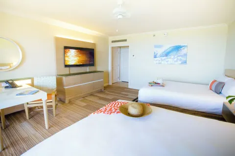 Accessible garden view room with two queen beds and TV at Grand Wailea Maui.