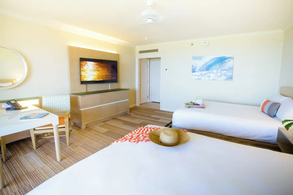 Accessible garden view room with two queen beds and TV at Grand Wailea Maui.