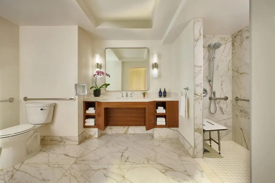 Accessible bathroom with roll-in shower and grab bars at Grand Wailea Maui.